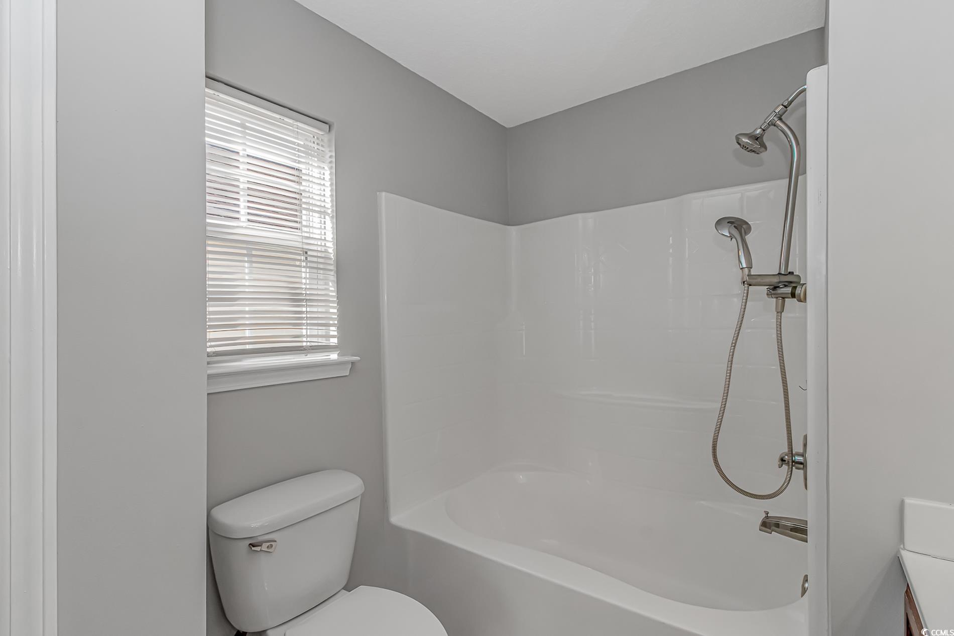502 Lake Shore Drive Surfside Beach, SC 29575 - Photo 13 of 25 Full bathroom featuring shower / bath combination and toilet