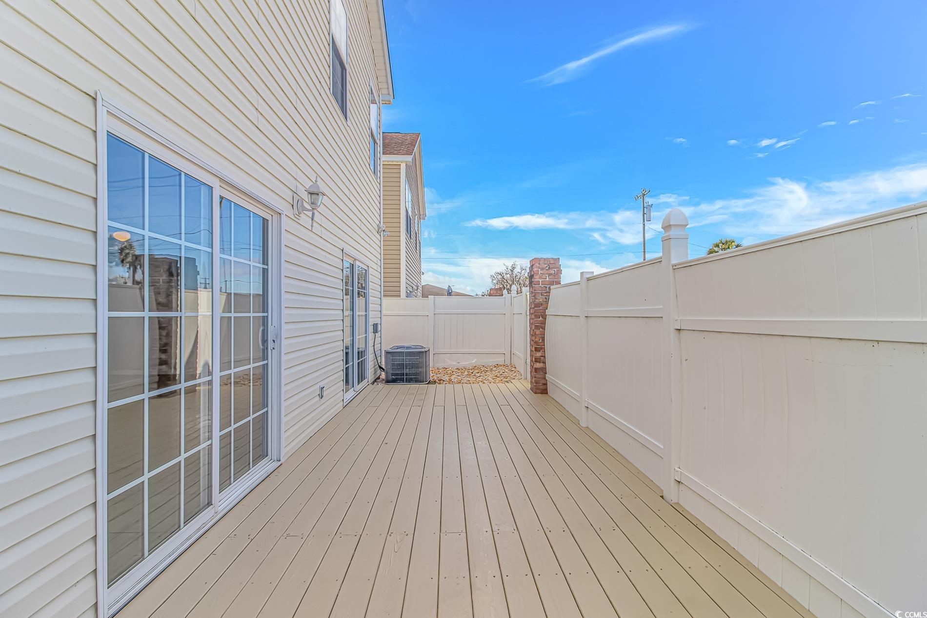 502 Lake Shore Drive Surfside Beach, SC 29575 - Photo 21 of 25 Wooden deck featuring a fenced backyard