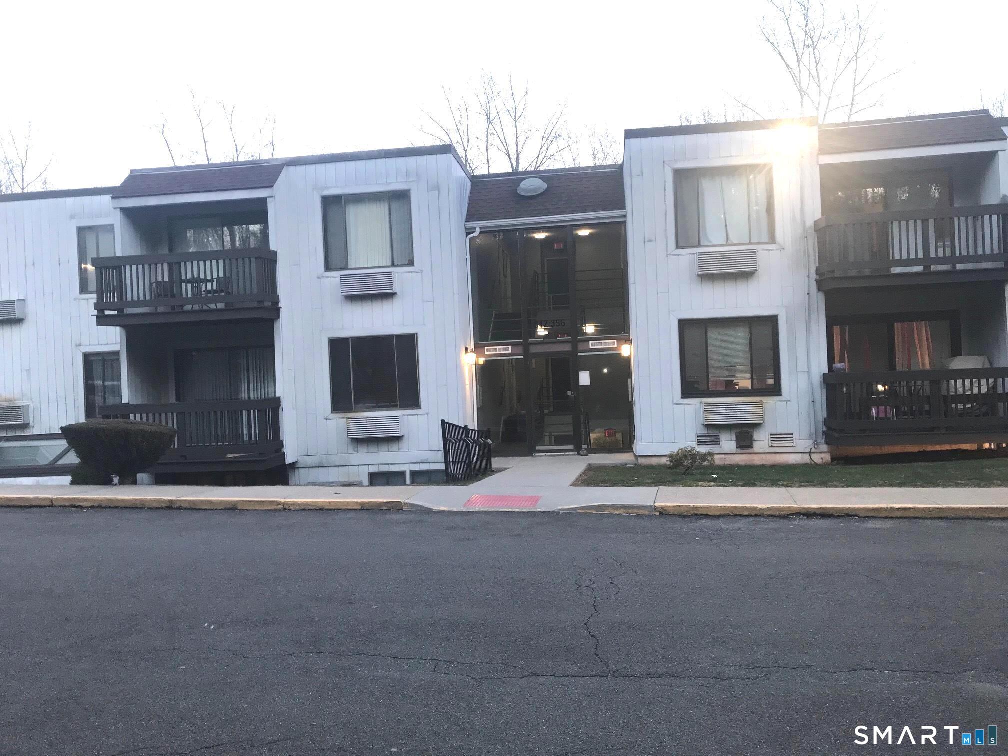 175 Mill Pond Road, Unit 346 Hamden, CT 06514 - Photo 2 of 18 a front view of a house with a yard