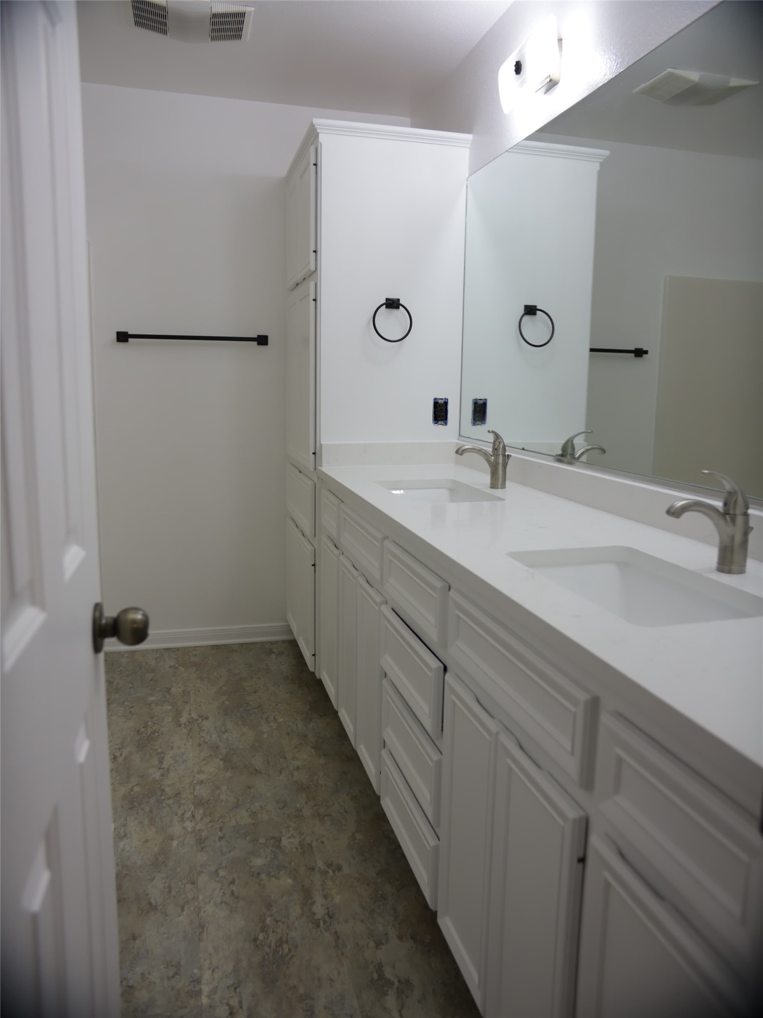 1612 Buttercup Road Pflugerville, TX 78660 - Photo 12 of 16 Dual vanities and a spacious countertop create a functional bathroom.