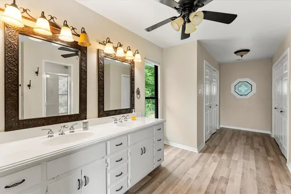 a view of a hallway with bathroom