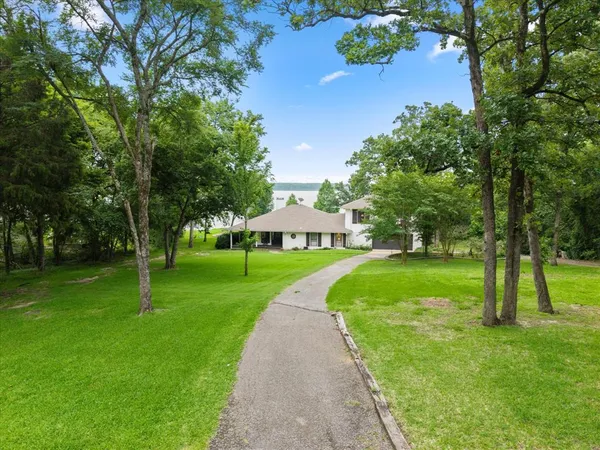 a view of a lake with a yard