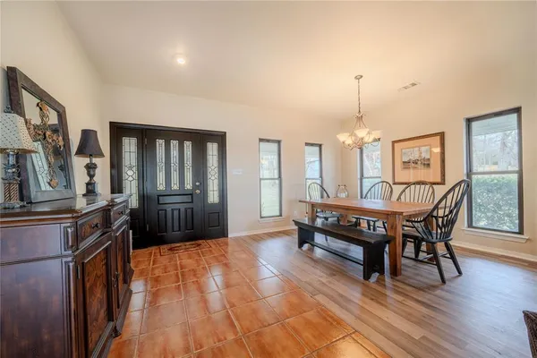 a view of a livingroom with furniture window and wooden floor