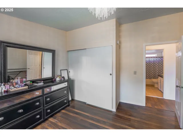 a view of room with wooden floor