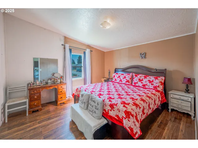 a bedroom with a bed and a table