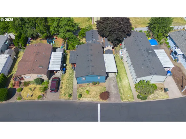 an aerial view of a house with a swimming pool