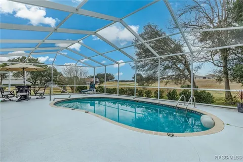 a view of a swimming pool with a patio
