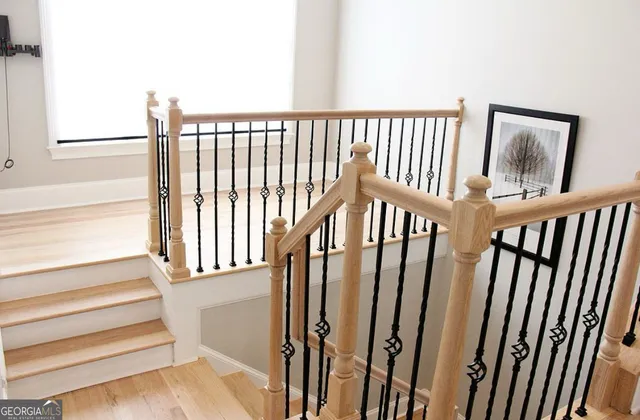 a view of hallway with wooden floor