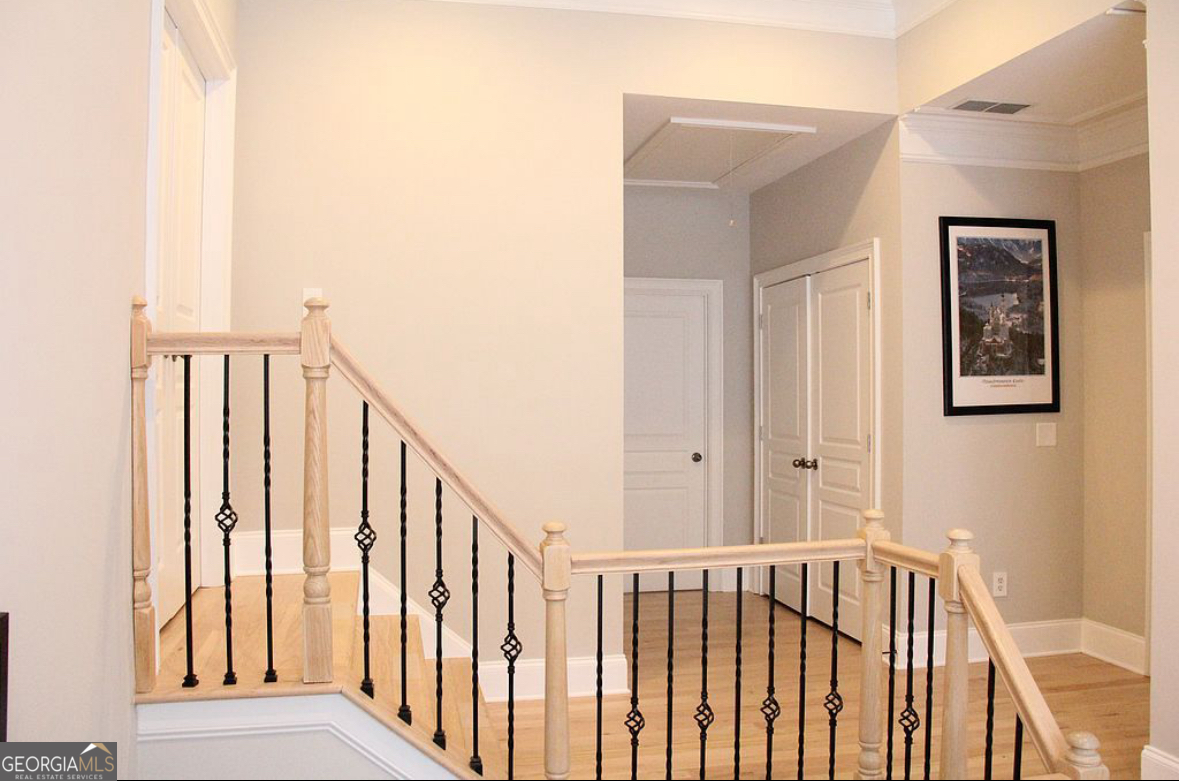 996 Pitts Road, Unit D Sandy Springs, GA 30350 - Photo 16 of 39 a view of hallway with wooden floor