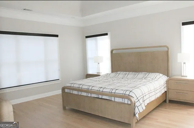 a room with a dresser and a window