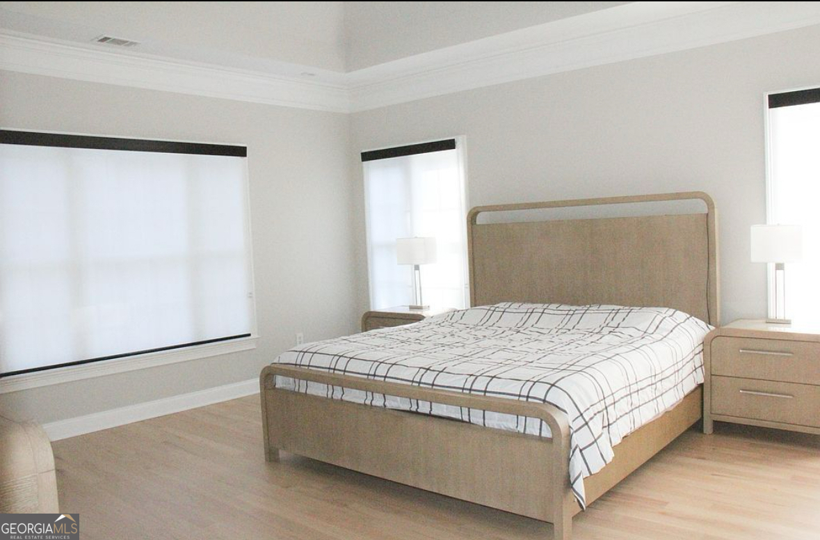 996 Pitts Road, Unit D Sandy Springs, GA 30350 - Photo 18 of 39 a bedroom with a bed and a window