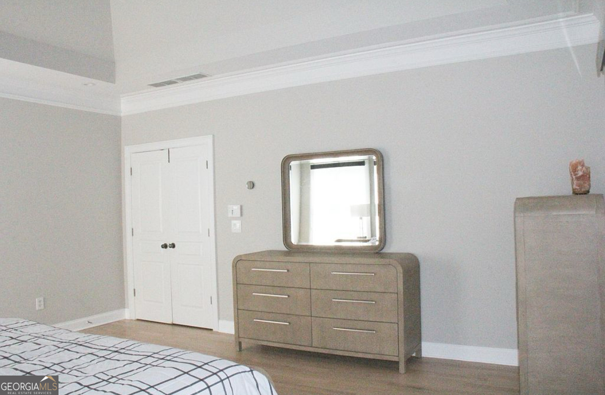 996 Pitts Road, Unit D Sandy Springs, GA 30350 - Photo 19 of 39 a bedroom with a bed and a window