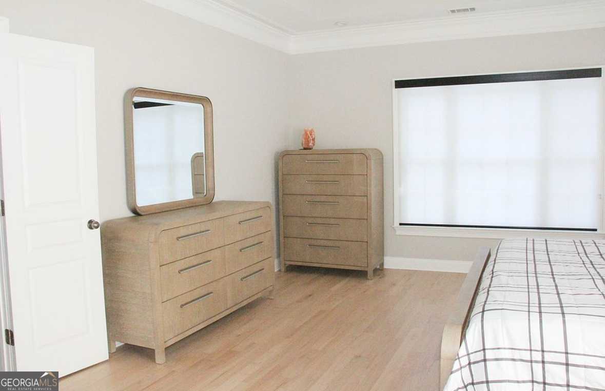 996 Pitts Road, Unit D Sandy Springs, GA 30350 - Photo 20 of 39 a room with a dresser and a window