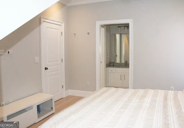 a bathroom with a granite countertop shower a sink and a mirror