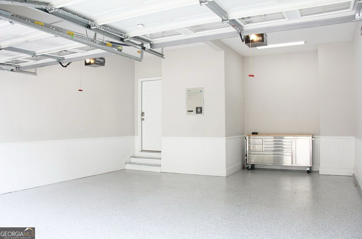 996 Pitts Road, Unit D Sandy Springs, GA 30350 - Photo 32 of 39 a view of walk in closet with clothes and shoes