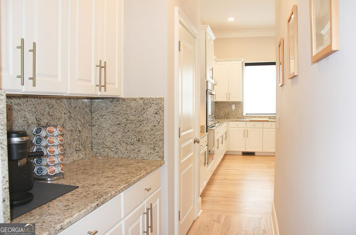 996 Pitts Road, Unit D Sandy Springs, GA 30350 - Photo 10 of 39 a bathroom with a granite countertop sink and a mirror