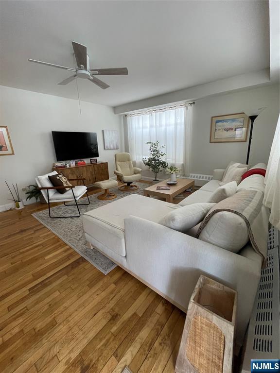 280-320 Oak Street, Unit 314 TI Ridgewood, NJ 07450 - Photo 4 of 16 a living room with furniture and a flat screen tv
