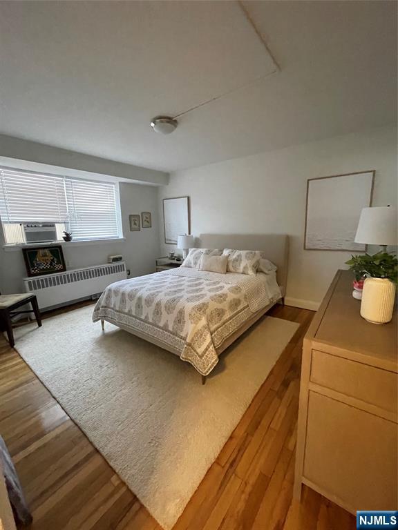 280-320 Oak Street, Unit 314 TI Ridgewood, NJ 07450 - Photo 7 of 16 a bedroom with a bed and dresser