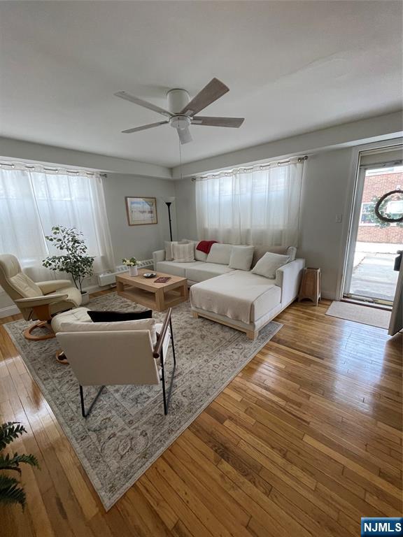 280-320 Oak Street, Unit 314 TI Ridgewood, NJ 07450 - Photo 10 of 16 a living room with furniture and wooden floor