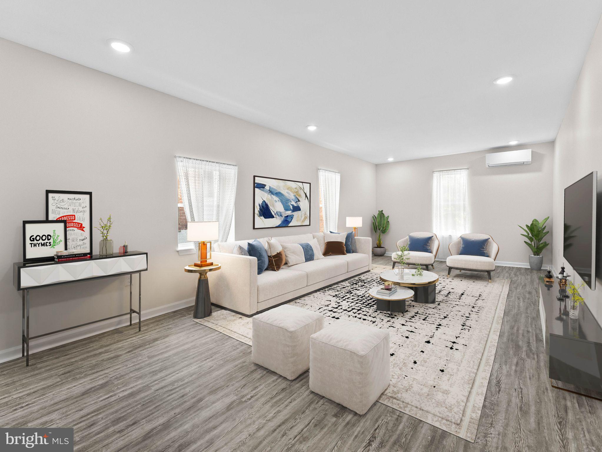 1923 North 20th Street, Unit 2 Philadelphia, PA 19121 - Photo 15 of 50 a living room with furniture a flat screen tv and a wooden floor