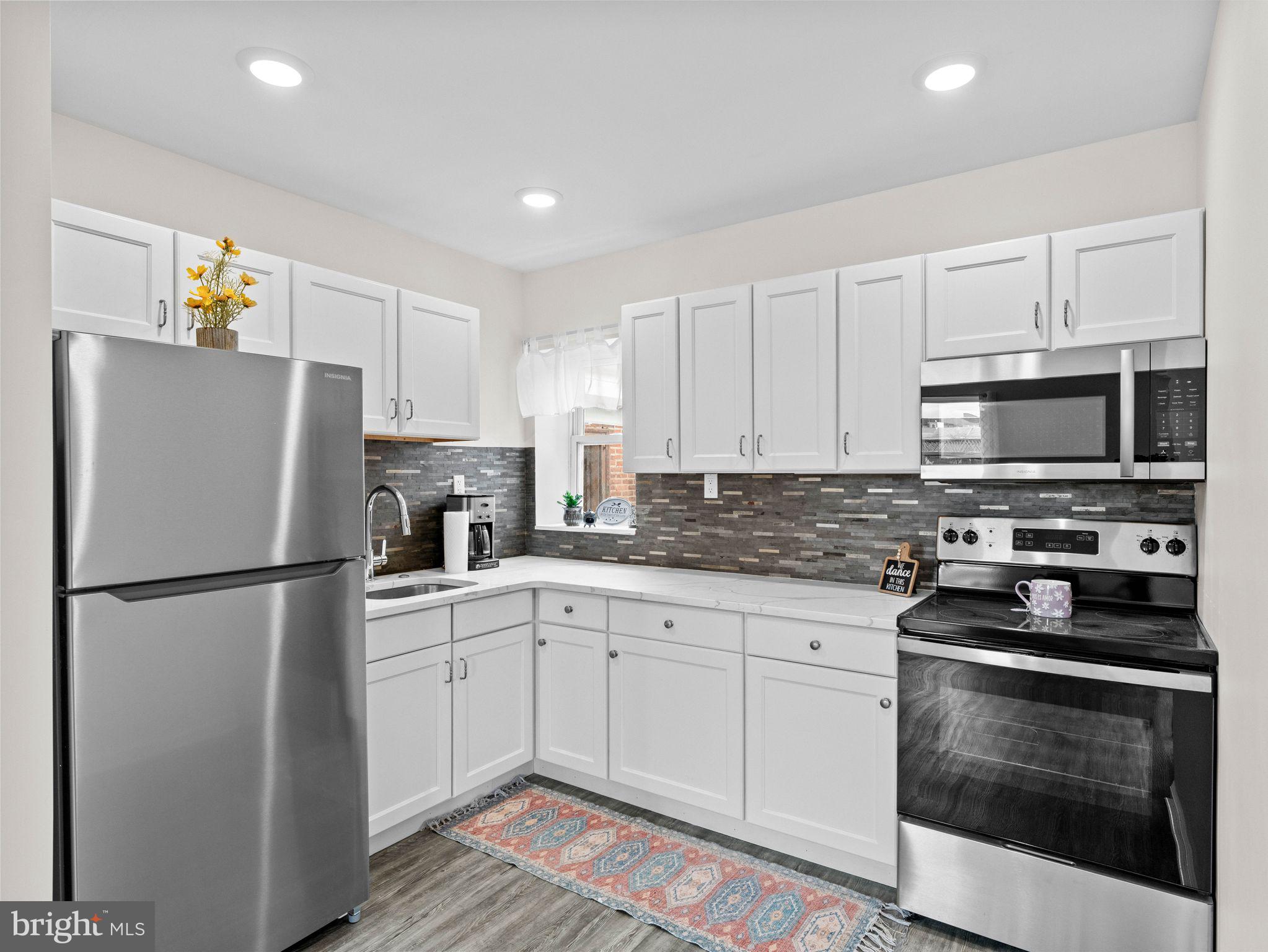 1923 North 20th Street, Unit 2 Philadelphia, PA 19121 - Photo 24 of 50 a white refrigerator freezer sitting in a kitchen