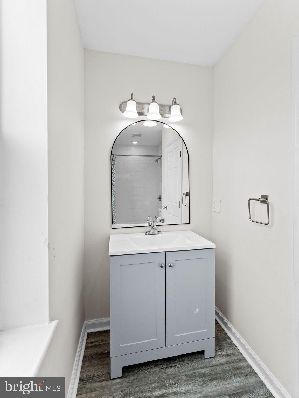 1923 North 20th Street, Unit 2 Philadelphia, PA 19121 - Photo 26 of 50 a bathroom with a sink and mirror