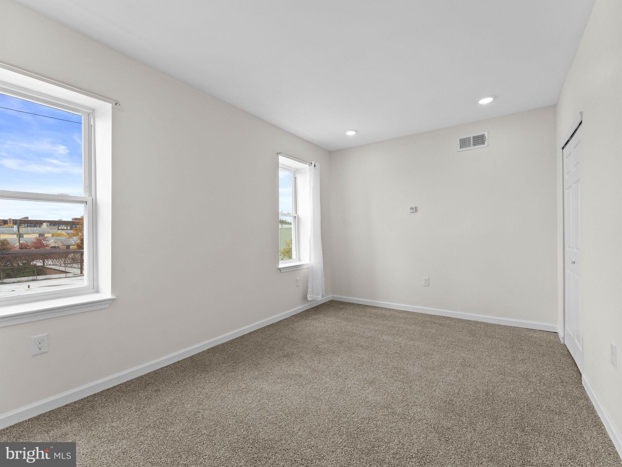 1923 North 20th Street, Unit 2 Philadelphia, PA 19121 - Photo 29 of 50 an empty room with windows
