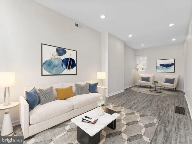 a living room with furniture and a rug