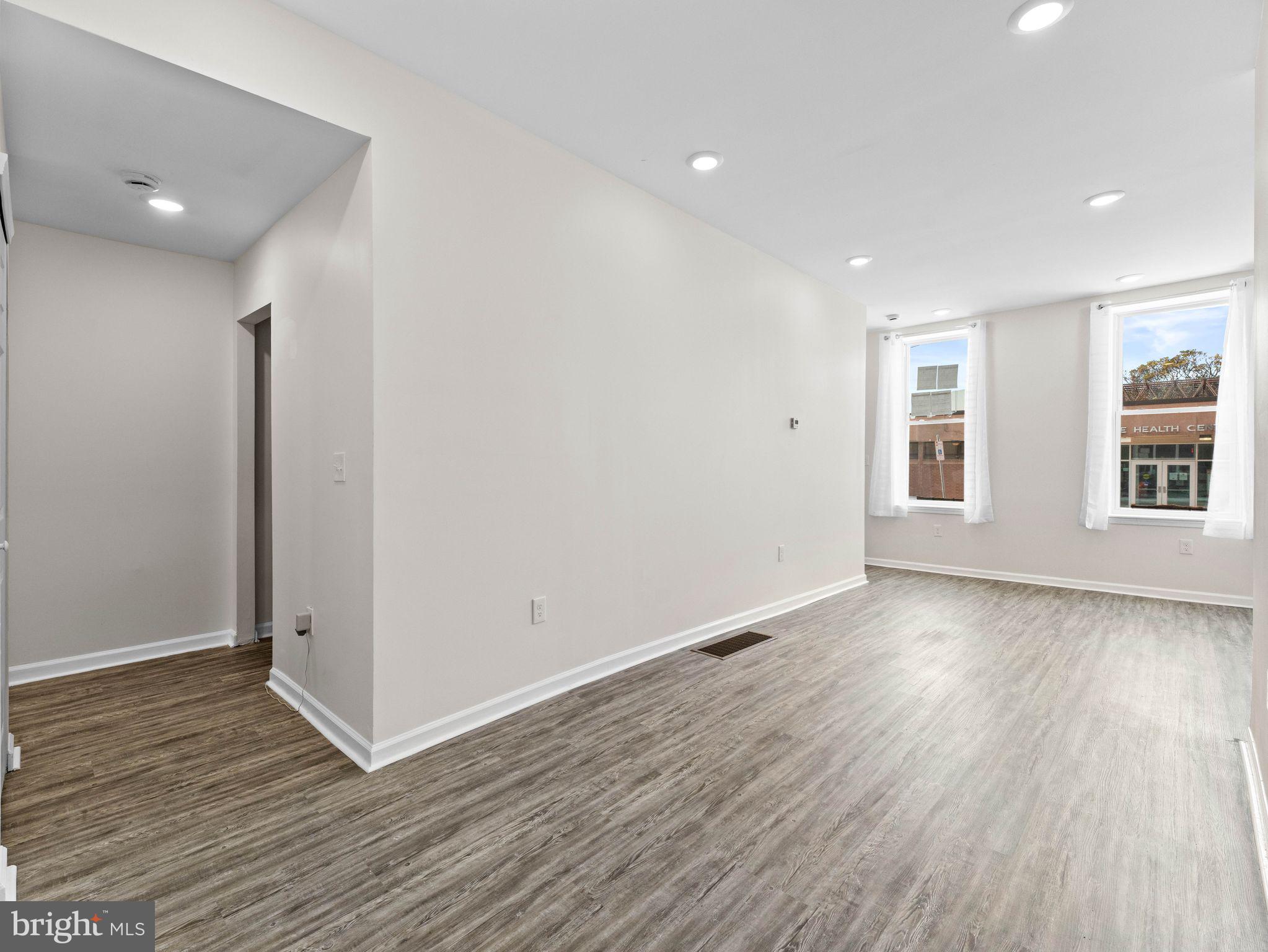 1923 North 20th Street, Unit 2 Philadelphia, PA 19121 - Photo 7 of 50 a view of a room with wooden floor and window