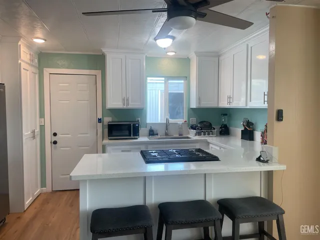 a kitchen with a table and chairs in it