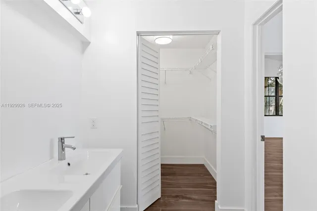 a bathroom with a sink and shower