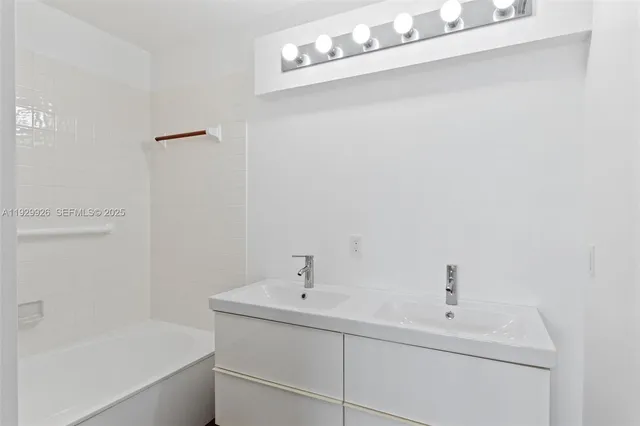 a bathroom with a sink and a bathtub