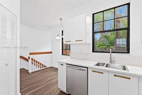 a kitchen with a sink and a window