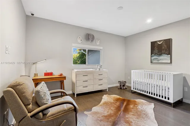 a bedroom with furniture and a window