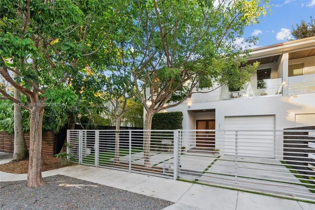 a house view with a backyard space