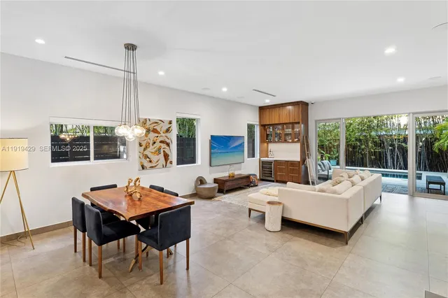 a living room with furniture rug and window