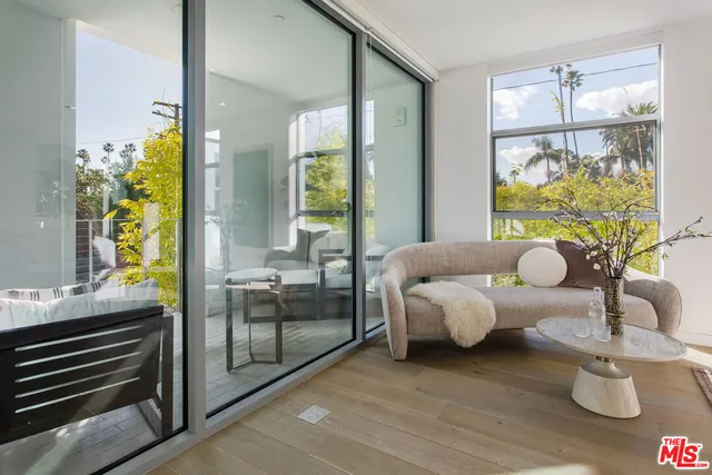 a bedroom with a large bed and a couch