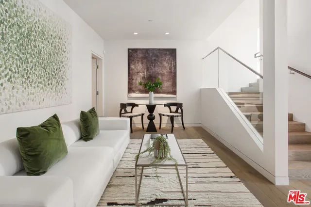 a view of a balcony with chairs