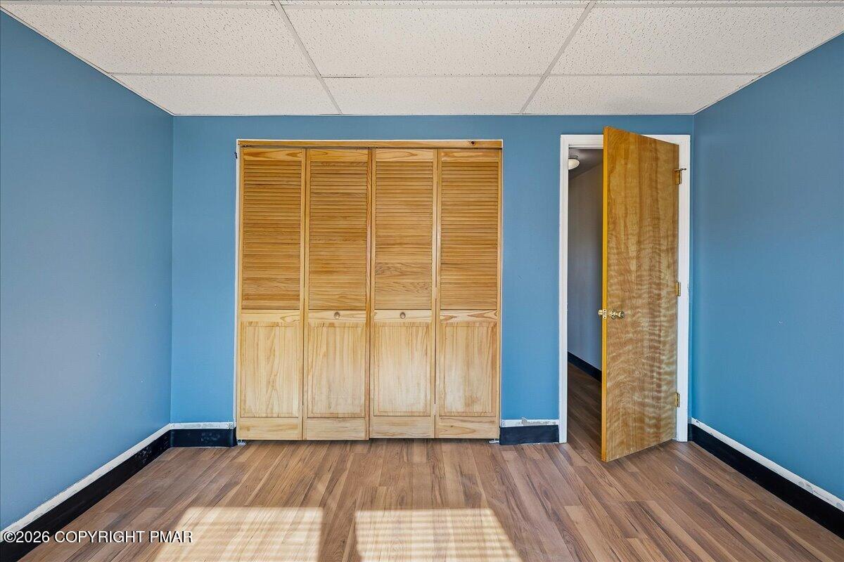 115 Spruce Street Nesquehoning, PA 18240 - Photo 25 of 38 a view of an empty room with wooden floor and a window
