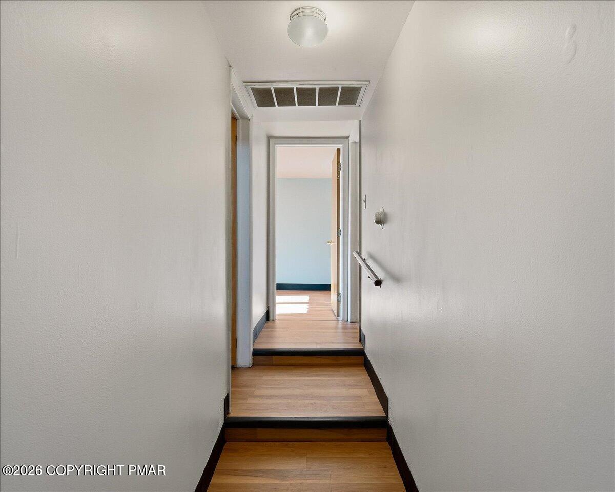 115 Spruce Street Nesquehoning, PA 18240 - Photo 28 of 38 a view of a hallway with wooden floor and a white door