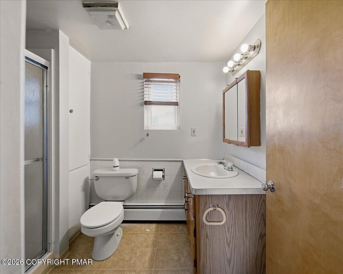 115 Spruce Street Nesquehoning, PA 18240 - Photo 29 of 38 a bathroom with a toilet sink and mirror