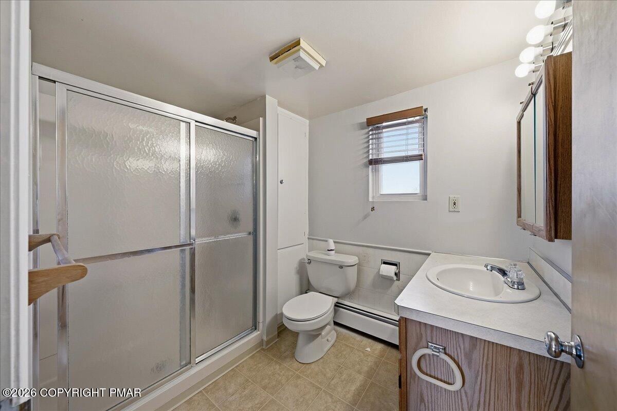 115 Spruce Street Nesquehoning, PA 18240 - Photo 30 of 38 a bathroom with a granite countertop sink toilet and shower