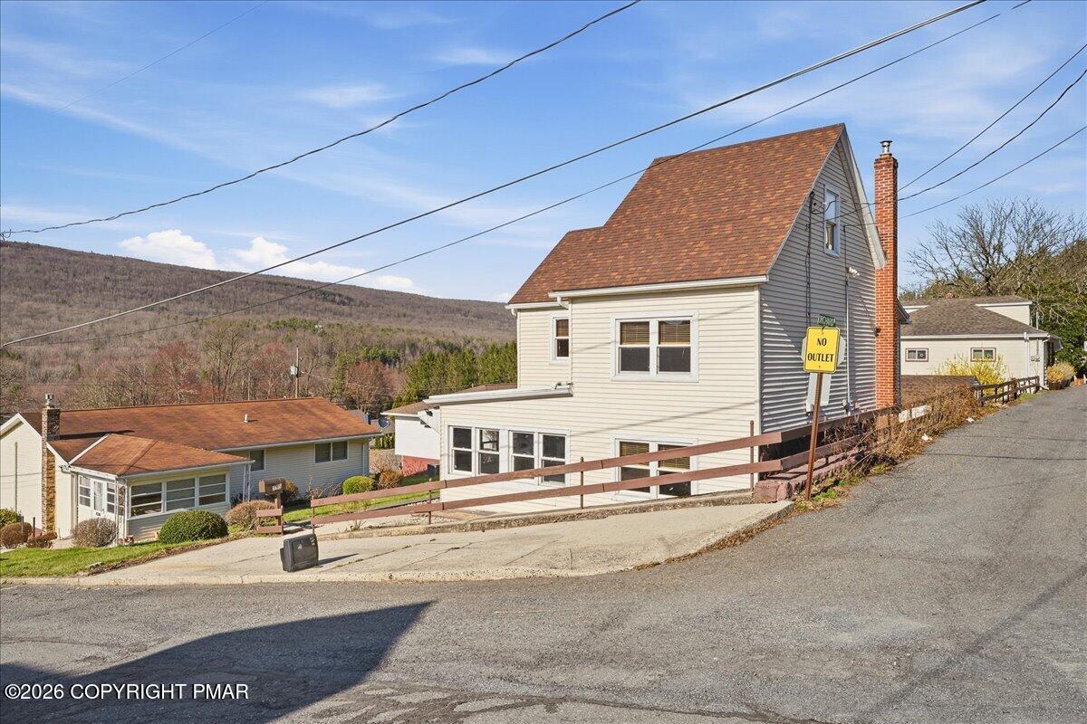 115 Spruce Street Nesquehoning, PA 18240 - Photo 3 of 38 a view of a white house with a large space in front of it