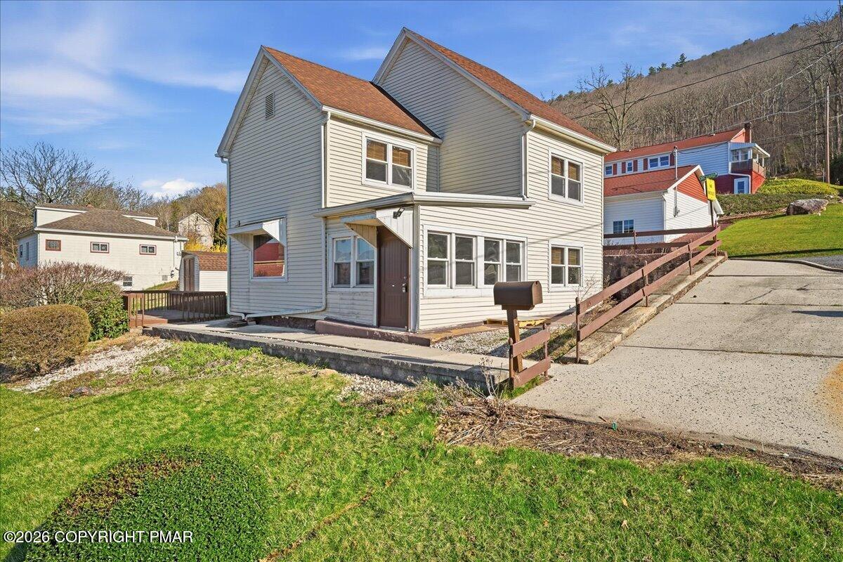 115 Spruce Street Nesquehoning, PA 18240 - Photo 4 of 38 front view of a house with a yard