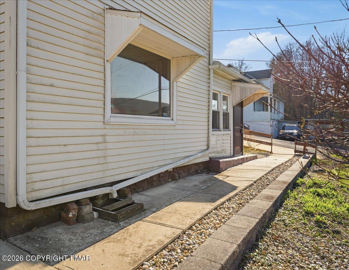 115 Spruce Street Nesquehoning, PA 18240 - Photo 6 of 38 a front view of a house with a yard