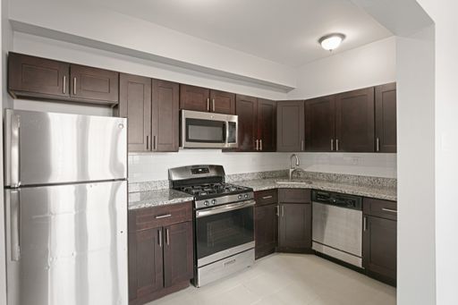 1608 West Sherwin Avenue, Unit 712 Chicago, IL 60626 - Photo 2 of 11 a kitchen with a refrigerator sink and microwave