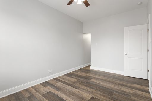 1608 West Sherwin Avenue, Unit 712 Chicago, IL 60626 - Photo 5 of 11 wooden floor in an empty room