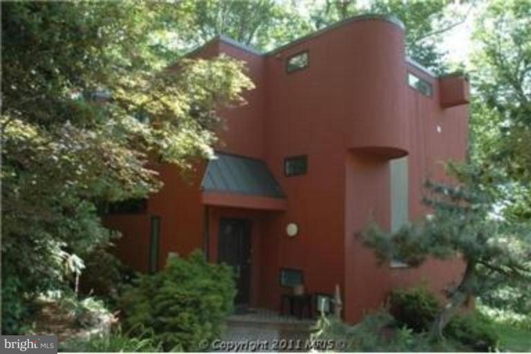 1801 Hatfield Road Huntingtown, MD 20639 - Photo 1 of 19 an aerial view of a house with a yard