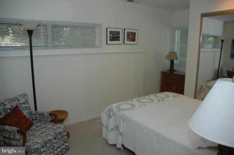 1801 Hatfield Road Huntingtown, MD 20639 - Photo 18 of 19 a bedroom with a bed and a window