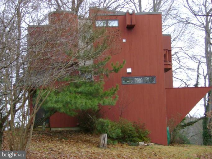 1801 Hatfield Road Huntingtown, MD 20639 - Photo 4 of 19 a brick building with a large tree